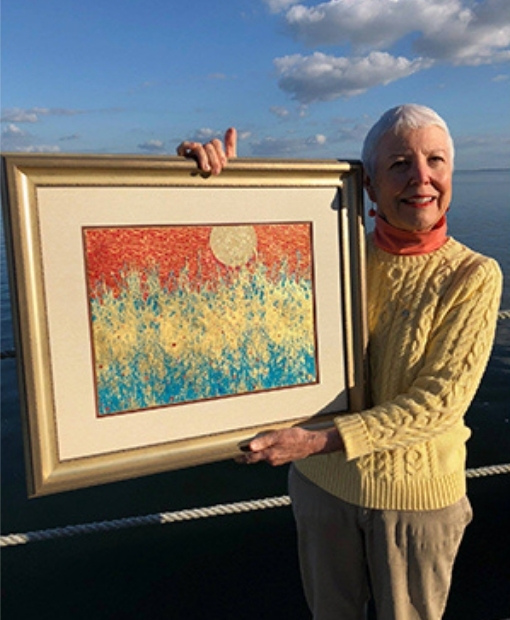 Customer holding framed artwork by My Favorite Art Place