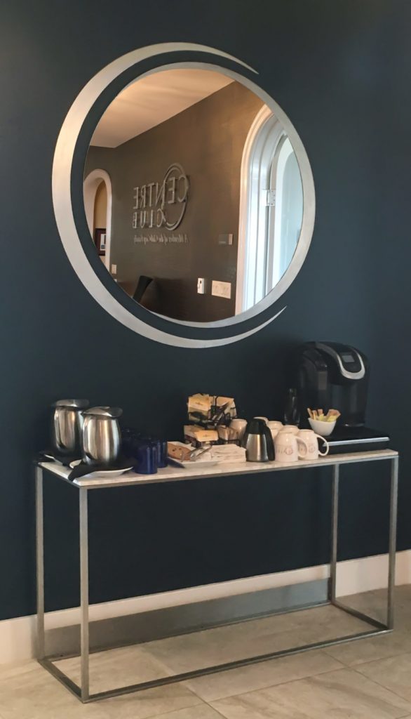 Circular mirror and console decor by My Favorite Art Place