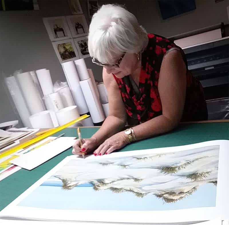 Artist working on custom framing by My Favorite Art Place