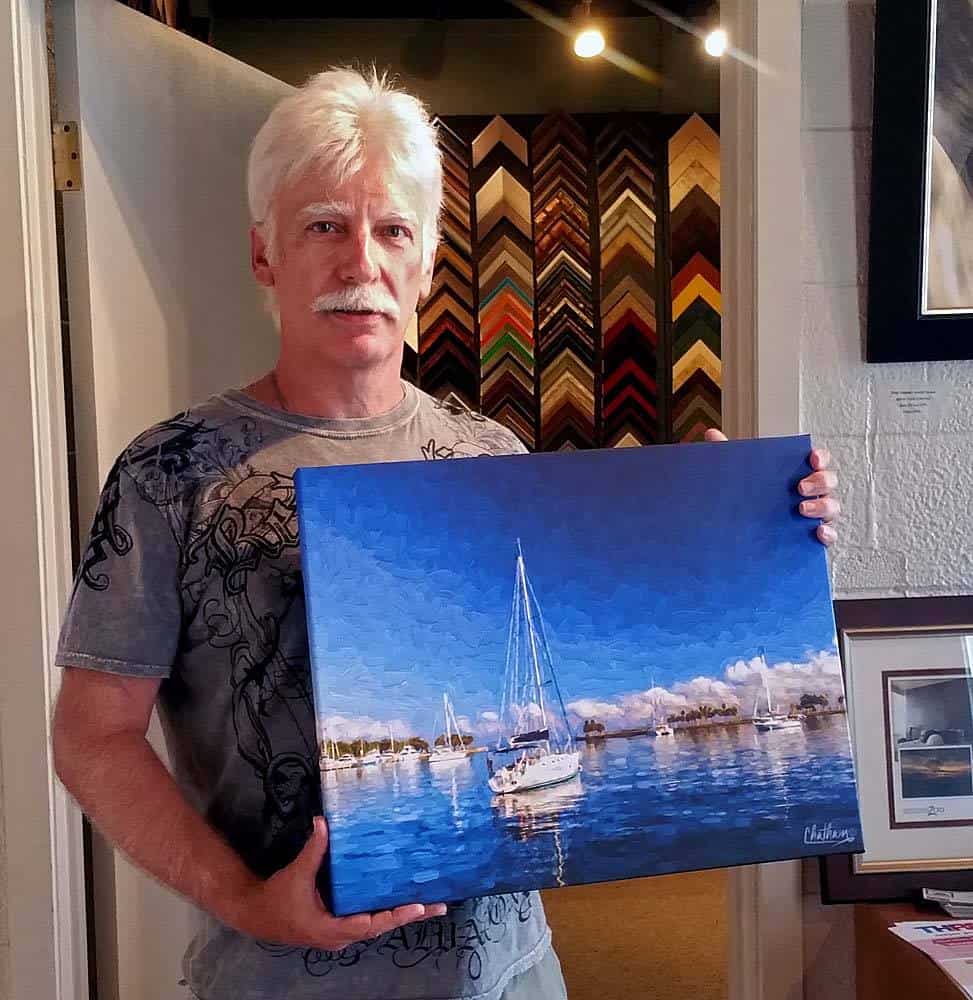 Customer holding framed artwork by My Favorite Art Place
