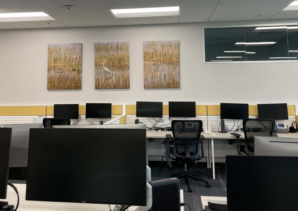 Open office area with framed art by My Favorite Art Place