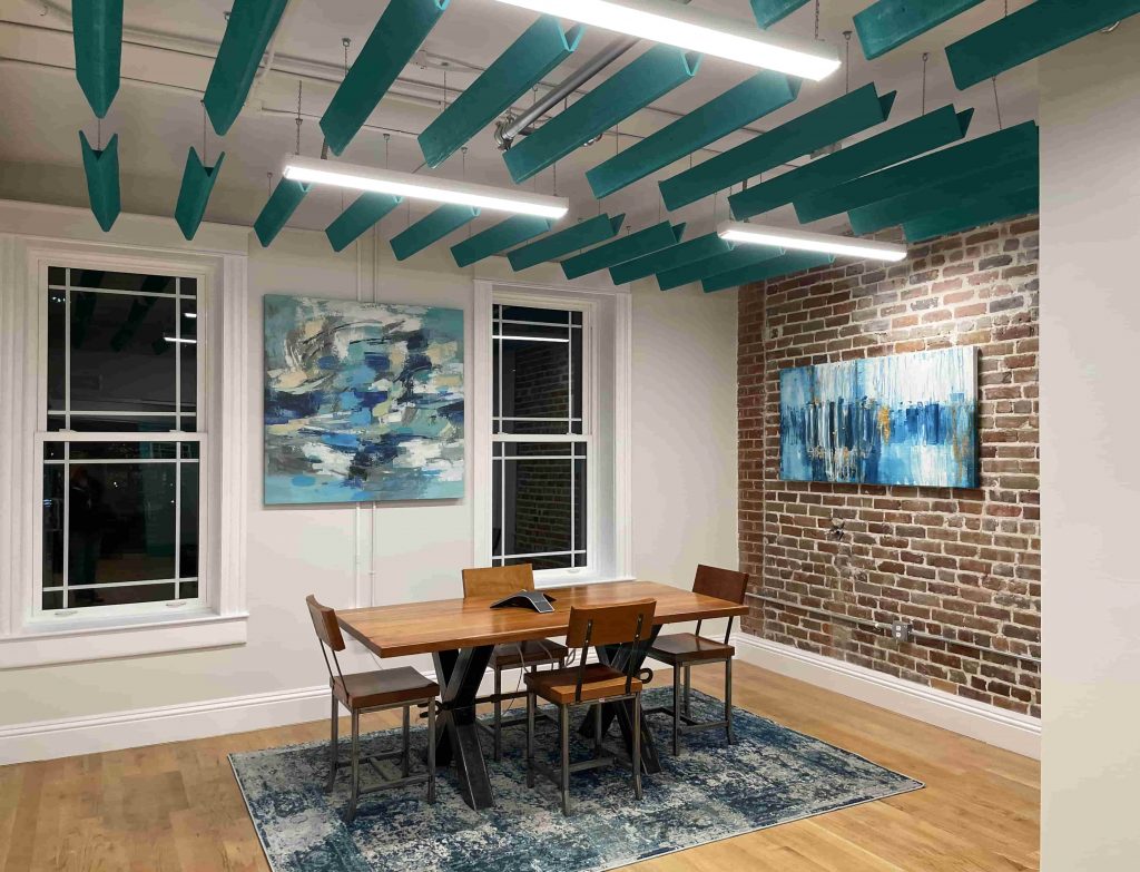 Creative workspace with exposed beams and art by My Favorite Art Place