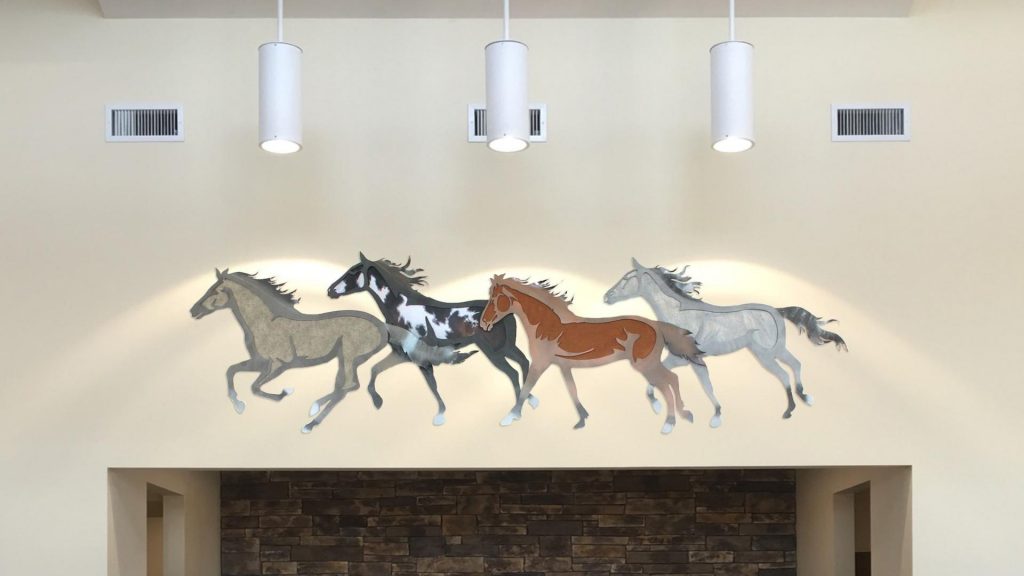 Running horses mural installation by My Favorite Art Place