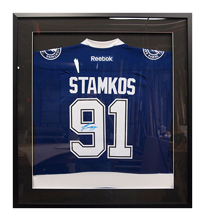 Framed hockey jersey display by My Favorite Art Place