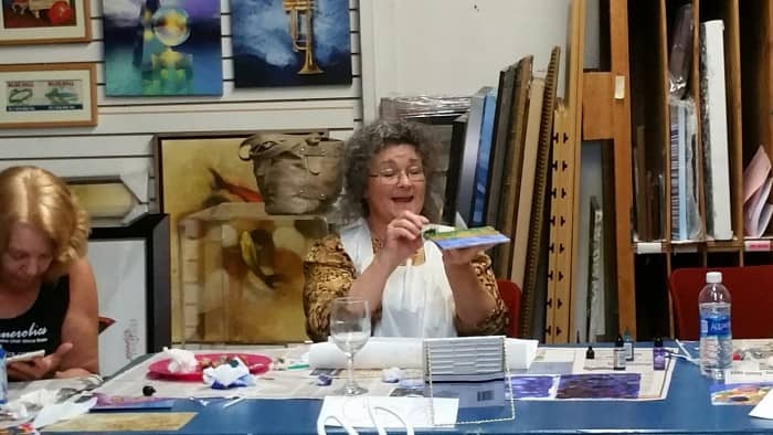 Artist speaking at podium during My Favorite Art Place event.