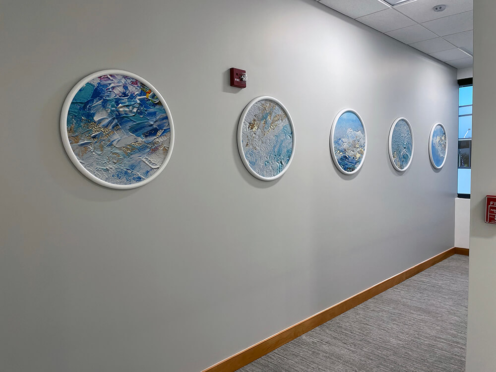 Circular wall art series displayed in hallway by My Favorite Art Place