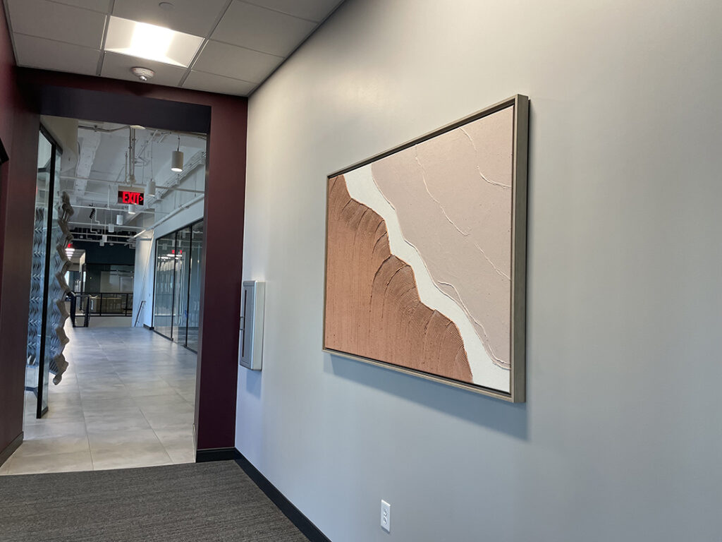 Office hallway featuring large abstract canvas art by My Favorite Art Place