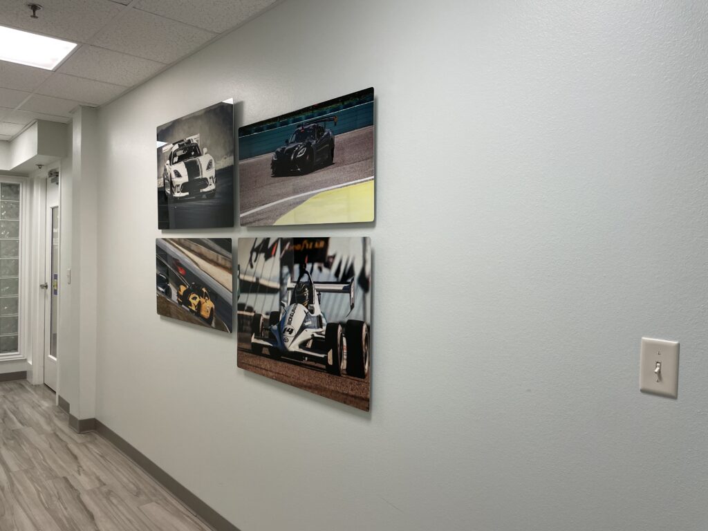 Gallery wall of framed photography in corporate office by My Favorite Art Place