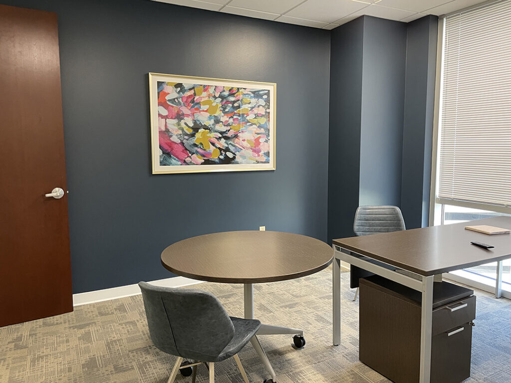 Small meeting room with colorful wall art by My Favorite Art Place